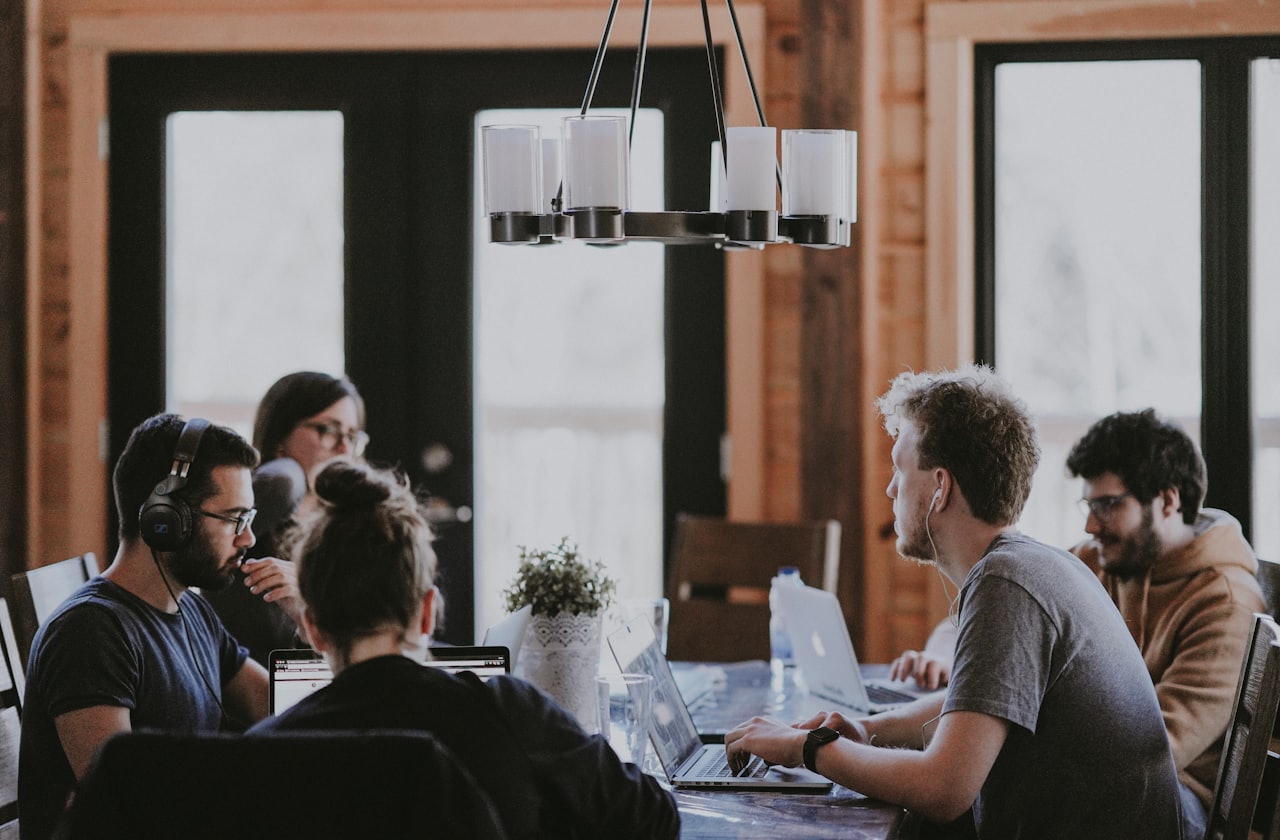 A New Zealand business team collaborating around Salesforce dashboards